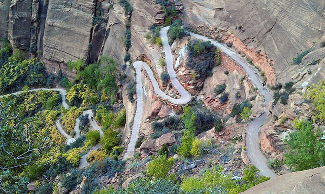Switchbacks on Angels Landing Trail, winding through rocks and trees